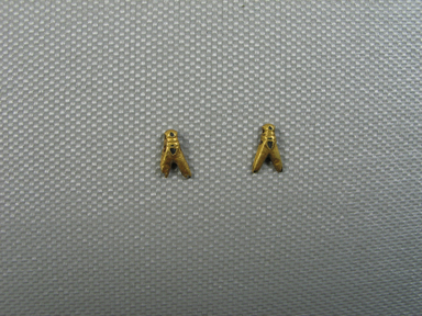  <em>Small Bead in Form of a Fly</em>, ca. 1539-1292 B.C.E. Gold, 1/4 x 1/16 x 3/8 in. (0.6 x 0.1 x 0.9 cm). Brooklyn Museum, Charles Edwin Wilbour Fund, 37.705E. Creative Commons-BY (Photo: , CUR.37.704E_37.705E_view01.jpg)