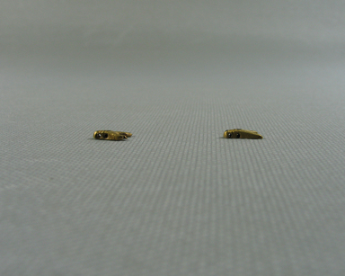  <em>Small Bead in Form of a Fly</em>, ca. 1539-1292 B.C.E. Gold, 3/16 x 1/16 x 3/8 in. (0.5 x 0.1 x 0.9 cm). Brooklyn Museum, Charles Edwin Wilbour Fund, 37.704E. Creative Commons-BY (Photo: , CUR.37.704E_37.705E_view02.jpg)