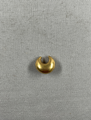  <em>Large Crescent - Shaped Earring</em>, 7th century B.C.E. Gold, 3/4 x 7/16 x 1/2 in. (1.9 x 1.1 x 1.2 cm). Brooklyn Museum, Charles Edwin Wilbour Fund, 37.752E. Creative Commons-BY (Photo: Brooklyn Museum, CUR.37.752E_overall01.JPG)