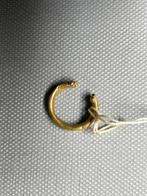  <em>Fragmentary Earring or Ring</em>. Gold, Greatest diam. 11/16 in. (1.8 cm). Brooklyn Museum, Charles Edwin Wilbour Fund, 37.768E. Creative Commons-BY (Photo: Brooklyn Museum, CUR.37.768E.JPG)