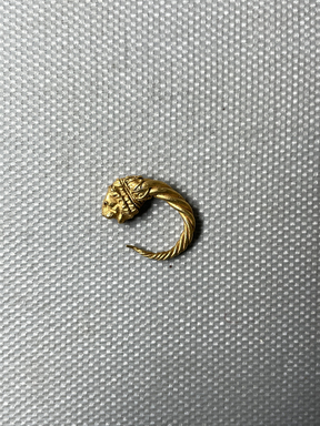  <em>Small Loop Earring with Lion's Head</em>, late 4th-3rd century B.C.E. Gold, Diameter: 11/16 in. (1.7 cm). Brooklyn Museum, Charles Edwin Wilbour Fund, 37.777E. Creative Commons-BY (Photo: Brooklyn Museum, CUR.37.777E_overall01.JPG)