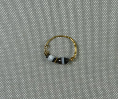  <em>Large Loop Earring</em>, 2nd-1st century B.C.E. Gold, onyx, sardonyx (possibly), Greatest diam.: 1 1/8 in. (2.8 cm). Brooklyn Museum, Charles Edwin Wilbour Fund, 37.784E. Creative Commons-BY (Photo: Brooklyn Museum, CUR.37.784E_view1.jpg)