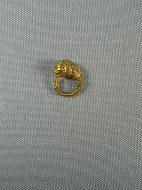 Greek. <em>Ornate Earring with Lion's Head</em>, late 4th–3rd century B.C.E. Gold, 3/8 × 7/8 in. (1 × 2.3 cm). Brooklyn Museum, Charles Edwin Wilbour Fund, 37.786E. Creative Commons-BY (Photo: Brooklyn Museum, CUR.37.786E_view1.jpg)