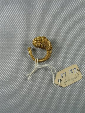 Greek. <em>Ornate Earring with Lion's Head</em>, late 4th–3rd century B.C.E. Gold, Diam. 7/8 in. (2.3 cm). Brooklyn Museum, Charles Edwin Wilbour Fund, 37.787E. Creative Commons-BY (Photo: Brooklyn Museum, CUR.37.787E_overall.jpg)