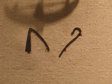  <em>Amulet Representing the Shepherd’s Crook</em>, 664-343 B.C.E. Electrum, 1 3/8 x 3/8 in. (3.5 x 0.9 cm). Brooklyn Museum, Charles Edwin Wilbour Fund, 37.794E. Creative Commons-BY (Photo: , CUR.37.793E_37.794E_wwg8.jpg)
