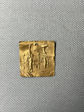  <em>Plaque with Figures of Isis and Nephthys in Relief</em>, 305-30 B.C.E. Gold, 1 1/8 × 1 1/8 × 1/16 in. (2.8 × 2.8 × 0.2 cm). Brooklyn Museum, Charles Edwin Wilbour Fund, 37.812E. Creative Commons-BY (Photo: Brooklyn Museum, CUR.37.812E_overall.JPG)