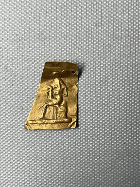  <em>Plaque with Figures of Isis Seated Holding the Child Horus</em>, 305-30 B.C.E. Gold, 1 9/16 × 7/8 × 1/16 in. (3.9 × 2.2 cm, 2.2mm). Brooklyn Museum, Charles Edwin Wilbour Fund, 37.813E. Creative Commons-BY (Photo: Brooklyn Museum, CUR.37.813E_overall.JPG)