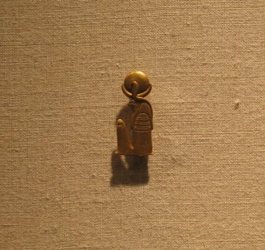  <em>Khonsu Amulet</em>, 664-343 B.C.E. Gold, 1 x 7/16 x 1/4 in. (2.6 x 1.1 x 0.6 cm). Brooklyn Museum, Charles Edwin Wilbour Fund, 37.825E. Creative Commons-BY (Photo: Brooklyn Museum, CUR.37.825E_wwg8.jpg)
