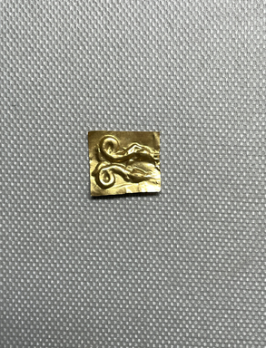  <em>Small Piece of Modern Sheet Gold Giving the Impression of the Die, 37.840E</em>. Sheet gold Brooklyn Museum, Charles Edwin Wilbour Fund, 37.840Ef. Creative Commons-BY (Photo: Brooklyn Museum, CUR.37.840Ef_overall.JPG)