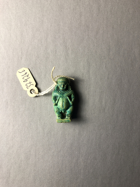  <em>Amulet of Pataikos with Nephthys</em>, 664-332 B.C.E. Faience, 1 1/8 × 9/16 × 3/8 in. (2.9 × 1.5 × 0.9 cm). Brooklyn Museum, Charles Edwin Wilbour Fund, 37.926E. Creative Commons-BY (Photo: , CUR.37.926E_view01.jpg)