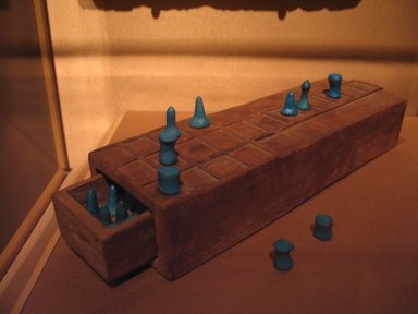  <em>Game Board with Separate Drawer</em>, ca. 1539-1295 B.C.E. Wood, 2 1/16 x 3 3/8 x 11 in. (5.3 x 8.5 x 28 cm). Brooklyn Museum, Charles Edwin Wilbour Fund, 37.93E. Creative Commons-BY (Photo: , CUR.37.93E_37.94E_mummychamber.jpg)