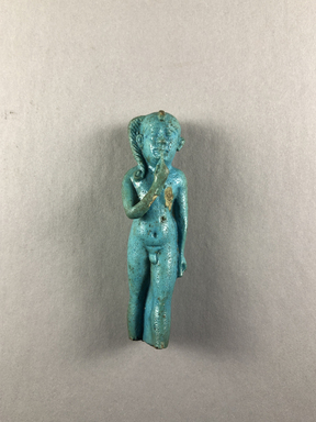  <em>Statue of the Child Horus Standing</em>, 664 B.C.E.-30 B.C.E. Faience, 3 1/16 × 7/8 × 13/16 in. (7.8 × 2.3 × 2 cm). Brooklyn Museum, Charles Edwin Wilbour Fund, 37.947E. Creative Commons-BY (Photo: , CUR.37.947E_view01.jpg)