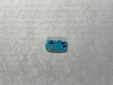  <em>Amulet of a Birth God</em>, ca. 1539-1478 B.C.E. Faience, 1 1/4 x 5/8 x 1/8 in. (3.2 x 1.6 x 0.3 cm). Brooklyn Museum, Charles Edwin Wilbour Fund, 37.967E. Creative Commons-BY (Photo: Brooklyn Museum, CUR.37.967E_overall.JPG)