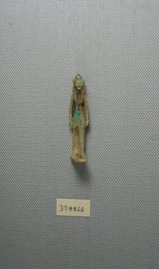  <em>Lion-Headed Goddess Amulet</em>, 664-525 B.C.E. Faience, 1 15/16 x 7/16 in. (5 x 1.1 cm). Brooklyn Museum, Charles Edwin Wilbour Fund, 37.982E. Creative Commons-BY (Photo: Brooklyn Museum, CUR.37.982E_View1.jpg)
