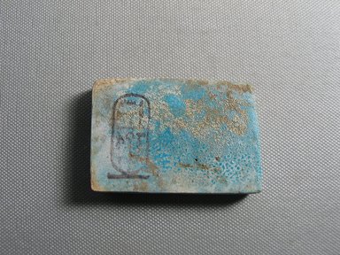 Nubian. <em>Plaque</em>, ca. 1352-1336 B.C.E. Faience, 1 13/16 × 2 11/16 × 3/8 in. (4.6 × 6.8 × 0.9 cm). Brooklyn Museum, Gift of the Egypt Exploration Society, 38.555. Creative Commons-BY (Photo: , CUR.38.555_view01.jpg)