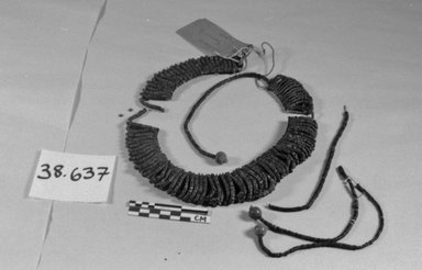 Samoan. <em>Necklace</em>. Coconut shell, fiber, clay, 14 15/16 x 4 3/4 in. (38 x 12 cm). Brooklyn Museum, Dick S. Ramsay Fund, 38.637. Creative Commons-BY (Photo: Brooklyn Museum, CUR.38.637_bw.jpg)