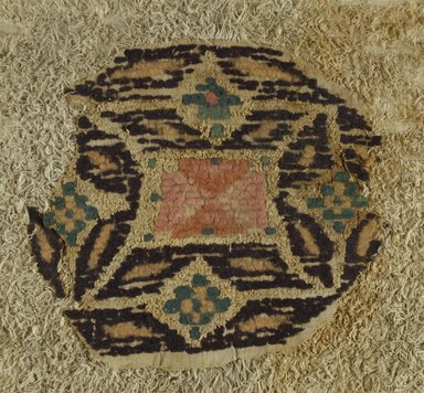 Coptic. <em>Roundel Fragment with Botanical and Geometric Decoration</em>, 5th-6th century C.E. Flax, wool, 11 3/4 x 12 1/2 in. (29.8 x 31.8 cm). Brooklyn Museum, Charles Edwin Wilbour Fund, 38.663. Creative Commons-BY (Photo: Brooklyn Museum (in collaboration with Index of Christian Art, Princeton University), CUR.38.663_ICA.jpg)