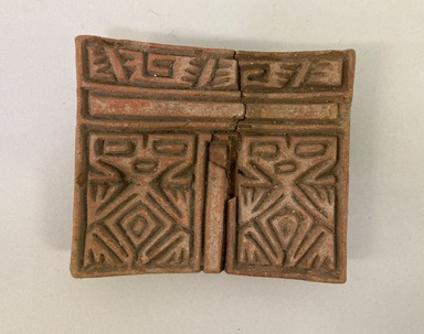 Possibly Aztec. <em>Stamp</em>. Reddish brown pottery, 2 13/16 × 1 × 3 1/4 in. (7.1 × 2.5 × 8.3 cm). Brooklyn Museum, Ella C. Woodward Memorial Fund, 39.123.53. Creative Commons-BY (Photo: Brooklyn Museum, CUR.39.123.53.jpg)