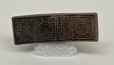 Possibly Aztec. <em>Stamp</em>, ca. 1000–1500. Ceramic, 2 5/8 x 1 3/16 x 3 1/4 in. (6.7 x 3 x 8.2 cm). Brooklyn Museum, Ella C. Woodward Memorial Fund, 39.123.6. Creative Commons-BY (Photo: Brooklyn Museum, CUR.39.123.6_overall01.jpg)