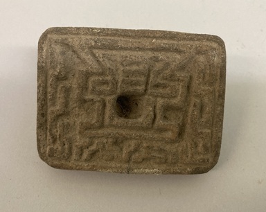 Possibly Zapotec. <em>Stamp</em>. Dark grayish brown pottery, 2 × 1 1/8 × 2 9/16 in. (5.1 × 2.9 × 6.5 cm). Brooklyn Museum, Ella C. Woodward Memorial Fund, 39.123.84. Creative Commons-BY (Photo: Brooklyn Museum, CUR.39.123.84.jpg)
