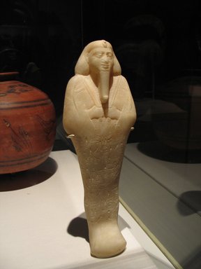 Nubian. <em>Ushabti of King Taharqa</em>, ca. 1075–656 B.C.E. Egyptian alabaster (calcite), 13 1/8 x 4 3/16 x depth at base 2 7/16 in. (33.3 x 10.7 x 6.2 cm). Brooklyn Museum, By exchange, 39.4. Creative Commons-BY (Photo: Brooklyn Museum, CUR.39.4_doubletake_2014.jpg)