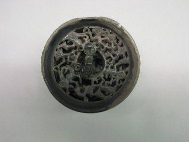  <em>Ear Plug</em>. Silver, D: 1 15/16 in. (5 cm); Th. 1 1/8 in. (2.8 cm). Brooklyn Museum, Museum Collection Fund, 39.565. Creative Commons-BY (Photo: Brooklyn Museum, CUR.39.565.jpg)