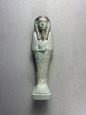 Nubian. <em>Ushabti of Senkamanisken</em>, ca. 633–613 B.C.E. Faience, 6 9/16 × 1 7/8 × 1 5/8 in. (16.6 × 4.7 × 4.1 cm). Brooklyn Museum, By exchange, 39.7. Creative Commons-BY (Photo: Brooklyn Museum, CUR.39.7_front01.JPG)