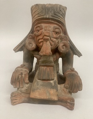 Zapotec. <em>Funerary Urn in Form of Seated Figure</em>. Ceramic pigment, 8 13/16 × 8 × 6 in. (22.4 × 20.3 × 15.2 cm). Brooklyn Museum, 40.715. Creative Commons-BY (Photo: Brooklyn Museum, CUR.40.715_overall.jpg)