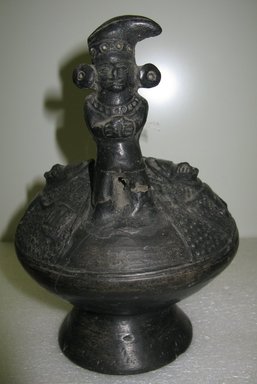 Lambayeque Chimú. <em>Whistling Bottle with Human Figure</em>, 1100-1400. Ceramic, 8 7/16 x 6 1/4 x 6 1/4 in. (21.4 x 15.9 x 15.9 cm). Brooklyn Museum, Museum Expedition 1941, Frank L. Babbott Fund, 41.1275.86. Creative Commons-BY (Photo: Brooklyn Museum, CUR.41.1275.86.jpg)