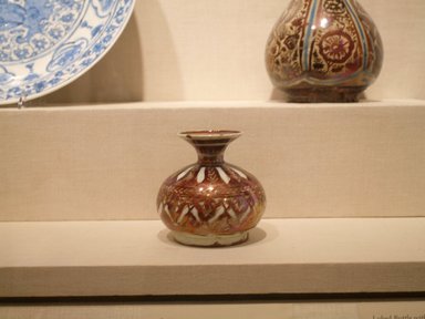  <em>Spittoon</em>, 17th century. Ceramic; fritware, painted in red (copper) and yellow (silver) luster on an opaque white glaze, 5 1/8 x 5 1/8 in. (13 x 13 cm). Brooklyn Museum, Gift of Mrs. Horace O. Havemeyer, 42.212.12. Creative Commons-BY (Photo: Brooklyn Museum, CUR.42.212.12.jpg)