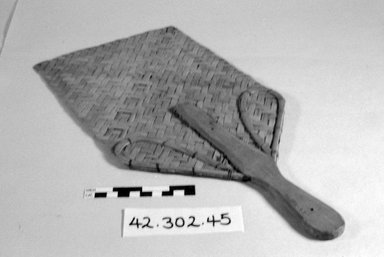  <em>Rectangular Raffia Fan</em>. Wood Brooklyn Museum, Gift of D. Irving Mead, 42.302.45. Creative Commons-BY (Photo: Brooklyn Museum, CUR.42.302.45_bw.jpg)