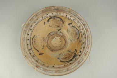 Coptic. <em>Large Dish Depicting Fish</em>, 6th century C.E. Clay, slip, 4 3/4 x 18 11/16 in. (12 x 47.5 cm). Brooklyn Museum, By exchange, 42.408. Creative Commons-BY (Photo: Brooklyn Museum (in collaboration with Index of Christian Art, Princeton University), CUR.42.408_ICA.jpg)