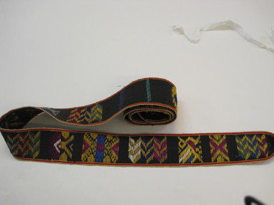  <em>Woman's Belt</em>, ca. 1942. Cotton, silk embroidery, 2 1/2 x 79 1/2 in. (6.4 x 202 cm) including braided fringe. Brooklyn Museum, Gift of C. F. Bieber, 42.438. Creative Commons-BY (Photo: , CUR.42.438.jpg)