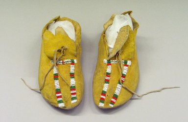 Comanche. <em>Pair of Woman's Moccasins</em>, early 20th century. Deerskin, glass bead, pigment, 9 13/16 x 3 15/16 in.  (25.0 x 10.0 cm). Brooklyn Museum, Gift of Mrs. Percy Jackson, 43.156.11. Creative Commons-BY (Photo: Brooklyn Museum, CUR.43.156.11.jpg)