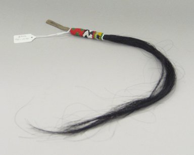 Sioux. <em>Horsehair Pendant</em>, early 20th century. Hide, horse hair, beads, approximate: 19 x 3/4 in. (48.3 x 1.9 cm). Brooklyn Museum, Anonymous gift in memory of Dr. Harlow Brooks, 43.201.178.2. Creative Commons-BY (Photo: Brooklyn Museum, CUR.43.201.178.2_view1.jpg)