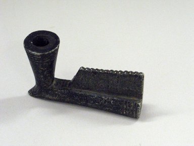 Native American. <em>Pipe Bowl with grooved lines and serrated flange</em>, 19th century. Black stone, 4 15/16 x 2 15/16 in. (12.5 x 7.5 cm). Brooklyn Museum, Anonymous gift in memory of Dr. Harlow Brooks, 43.201.235. Creative Commons-BY (Photo: Brooklyn Museum, CUR.43.201.235.jpg)