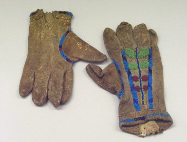 Probably Blackfoot. <em>Pair of Gloves</em>, 1900–1940. Hide, beads, 10 5/8 x 6 1/2 in. (27 x 16.5 cm). Brooklyn Museum, Anonymous gift in memory of Dr. Harlow Brooks, 43.201.27a-b. Creative Commons-BY (Photo: Brooklyn Museum, CUR.43.201.27a-b.jpg)