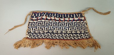 Arawak. <em>Woman's Apron</em>, early 20th century. Glass beads, cotton, 5 3/4 × 11 1/2 × 3/8 in. (14.6 × 29.2 × 1 cm), includes fringe. Brooklyn Museum, Anonymous gift in memory of Dr. Harlow Brooks, 43.201.34. Creative Commons-BY (Photo: Brooklyn Museum, CUR.43.201.34_view01.jpg)