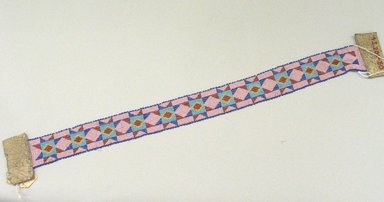 Great Lakes. <em>Woven, Beadwork Headband</em>, 20th century. Beads, hide, 24 13/16 x 1 7/8 in. (63 x 4.8 cm). Brooklyn Museum, Anonymous gift in memory of Dr. Harlow Brooks, 43.201.50. Creative Commons-BY (Photo: Brooklyn Museum, CUR.43.201.50_view1.jpg)