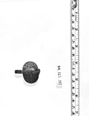  <em>Amuletic Scarab</em>, ca. 1292–1075 B.C.E. Stone, bronze, 1/2 × 15/16 × 1 9/16 in. (1.3 × 2.4 × 4 cm). Brooklyn Museum, Charles Edwin Wilbour Fund, 44.123.107. Creative Commons-BY (Photo: Brooklyn Museum, CUR.44.123.107_negA_bw.jpg)