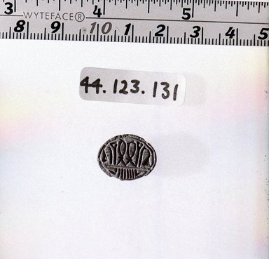  <em>Lentoid Seal-amulet</em>, ca. 1630-1539 B.C.E. Steatite, glaze, 3/16 x 1/2 x 11/16 in. (0.5 x 1.3 x 1.7 cm). Brooklyn Museum, Charles Edwin Wilbour Fund, 44.123.131. Creative Commons-BY (Photo: Brooklyn Museum, CUR.44.123.131_negA_bw.jpg)