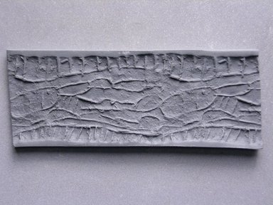  <em>Cylinder Seal or Cylindrical Bead</em>. Faience, 3/4 x 3/8 in. (1.9 x 0.9 cm). Brooklyn Museum, Charles Edwin Wilbour Fund, 44.123.135. Creative Commons-BY (Photo: Brooklyn Museum, CUR.44.123.135_impression.jpg)