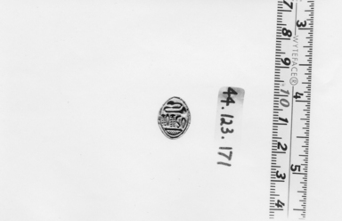  <em>Lentoid Seal Amulet</em>, ca. 1630-1539 B.C.E. Steatite, glaze, 1/4 x 1/2 x 9/16 in. (0.6 x 1.2 x 1.5 cm). Brooklyn Museum, Charles Edwin Wilbour Fund, 44.123.171. Creative Commons-BY (Photo: , CUR.44.123.171_NegA_print_bw.jpg)