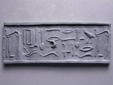  <em>Cylinder Seal</em>. Wood (Egyptian ebony), 1 1/16 x 7/8 in. (2.7 x 2.3 cm). Brooklyn Museum, Charles Edwin Wilbour Fund, 44.123.23. Creative Commons-BY (Photo: Brooklyn Museum, CUR.44.123.23_impression.jpg)