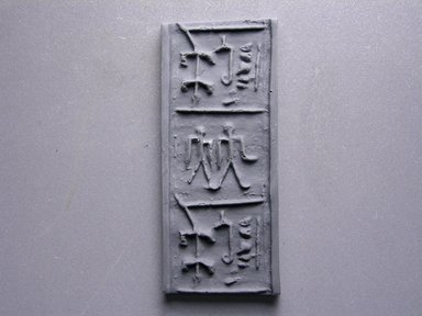 <em>Cylinder Seal</em>. Faience, 15/16 x 1/2 in. (2.4 x 1.2 cm). Brooklyn Museum, Charles Edwin Wilbour Fund, 44.123.44. Creative Commons-BY (Photo: Brooklyn Museum, CUR.44.123.44_impression.jpg)