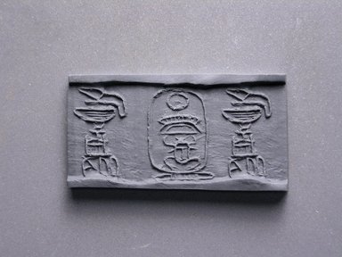  <em>Cylinder Seal</em>. Steatite, glaze, 3/4 x 5/16 in. (1.9 x 0.8 cm). Brooklyn Museum, Charles Edwin Wilbour Fund, 44.123.56. Creative Commons-BY (Photo: Brooklyn Museum, CUR.44.123.56_impression.jpg)