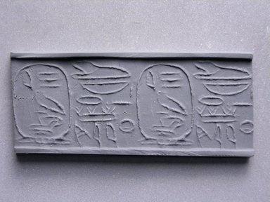  <em>Cylinder Seal with Name of Amenemhat</em>. Steatite, glaze, 3/4 x 1/4 in. (1.9 x 0.7 cm). Brooklyn Museum, Charles Edwin Wilbour Fund, 44.123.70. Creative Commons-BY (Photo: Brooklyn Museum, CUR.44.123.70_impression.jpg)