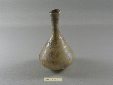 Roman. <em>Vase of Bottle</em>, 1st–2nd century or 4th–6th century C.E. Glass, 5 3/16 x Diam. 3 1/8 in. (13.1 x 8 cm). Brooklyn Museum, Gift of Mrs. Adrian Van Sinderen, 46.154.8. Creative Commons-BY (Photo: Brooklyn Museum, CUR.46.154.8_view1.jpg)