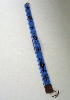 Flathead. <em>Belt with Blue and Gilt Beaded Geometric Pattern</em>. Hide, beads, 34 3/4 x 1 3/4 in. (88.5 x 4.5 cm). Brooklyn Museum, Charles Stewart Smith Memorial Fund, 46.96.7. Creative Commons-BY (Photo: Brooklyn Museum, CUR.46.96.7_view1.jpg)