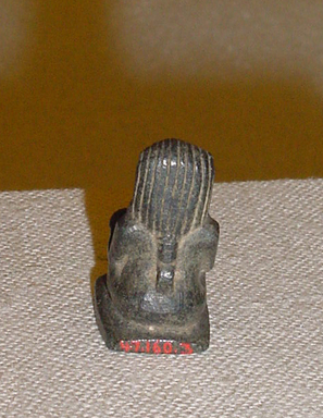  <em>Seated King Amulet</em>. Steatite Brooklyn Museum, Gift of the Estate of Harriet H. White, 47.160.3. Creative Commons-BY (Photo: , CUR.47.160.3_view02.jpg)